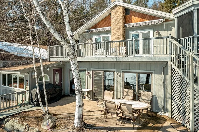 Winnipesaukee Waterfront Home sleeping 12 dock and sandy beach