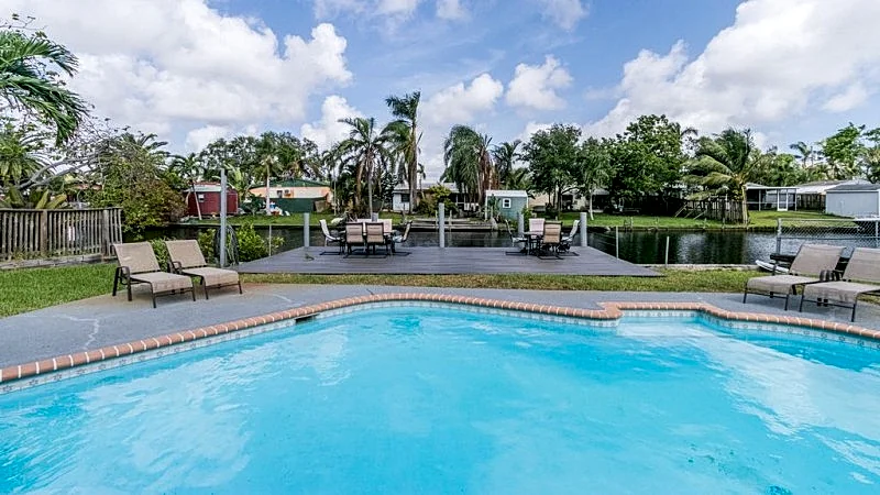 TROPICAL WATERFRONT.. 5 BEDROOMS. 2 BATH. WATER FRONT HOME.