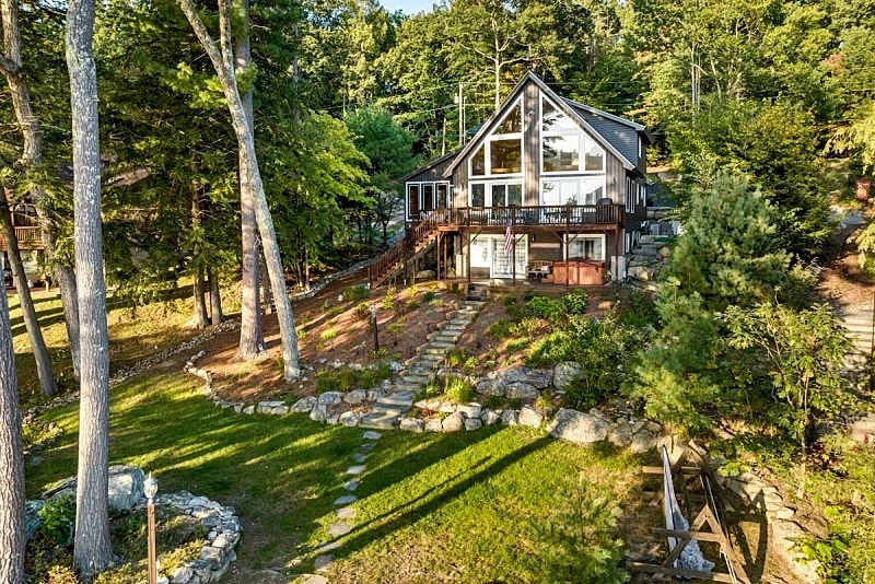 Adirondack style Winnipesaukee waterfront home with 4 bedrooms and SW EXP