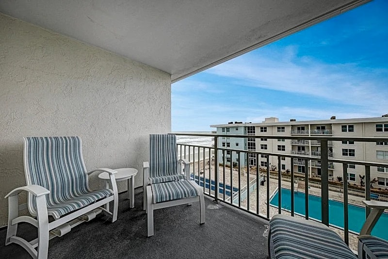 Top-floor condo with ocean and pool views, private balcony, and multiple beachfront pools in New Smyrna Beach, Florida, United States — photo 3