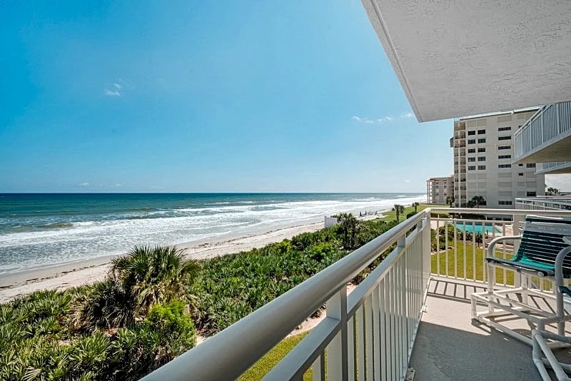 Direct oceanfront condo with a large balcony, heated pool, and beach access in New Smyrna Beach, Florida, United States — photo 2