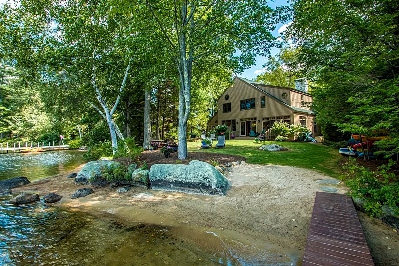 Waterfront home in Moultonborough with sandy beach and dock
