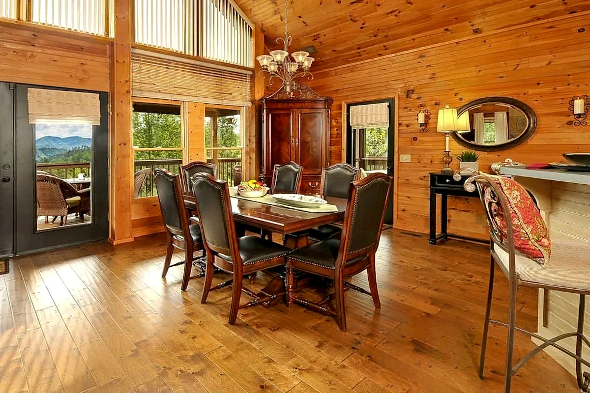 Dining at Private wrap around deck, hot tub under the stars, dog run, horseshoe, fire pit in Pigeon Forge, Tennessee, United States