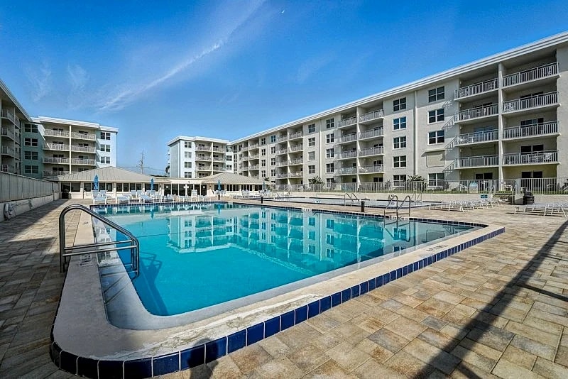 Top-floor condo with ocean and pool views, private balcony, and multiple beachfront pools in New Smyrna Beach, Florida, United States — photo 4