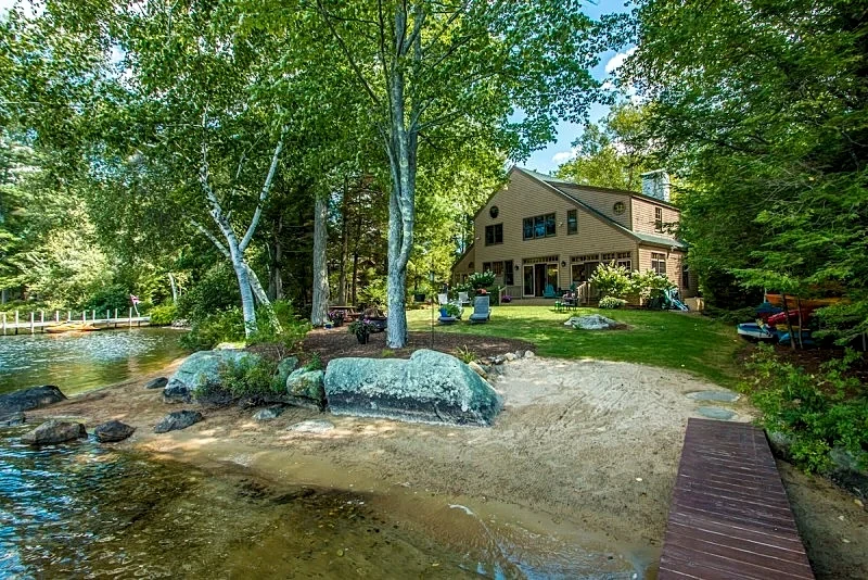 Waterfront home in Moultonborough with sandy beach and dock