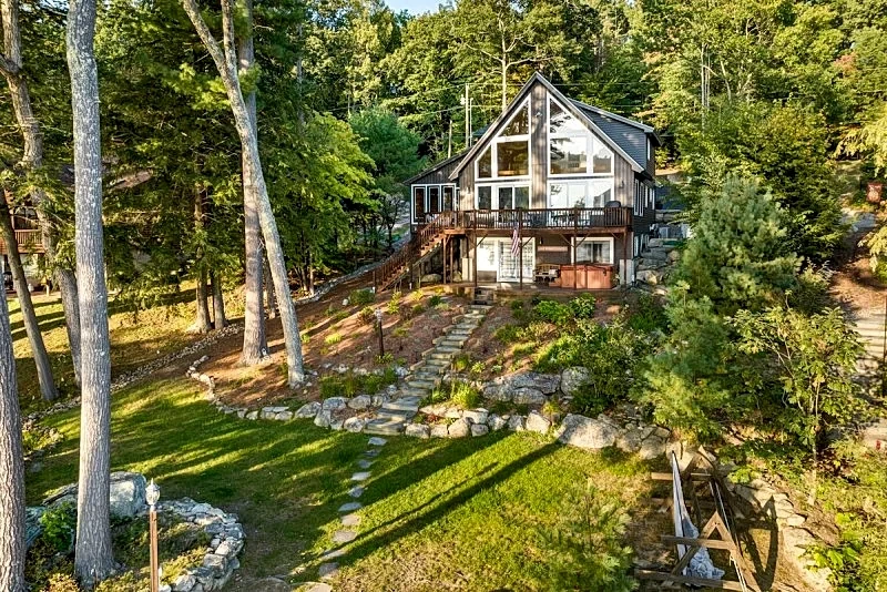 Adirondack style Winnipesaukee waterfront home with 4 bedrooms and SW EXP