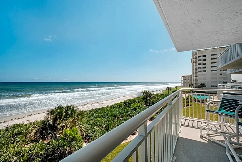 Direct oceanfront condo with a large balcony, heated pool, and beach access in New Smyrna Beach, Florida, United States — photo 2