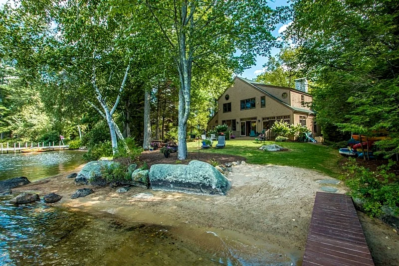 Waterfront home in Moultonborough with sandy beach and dock
